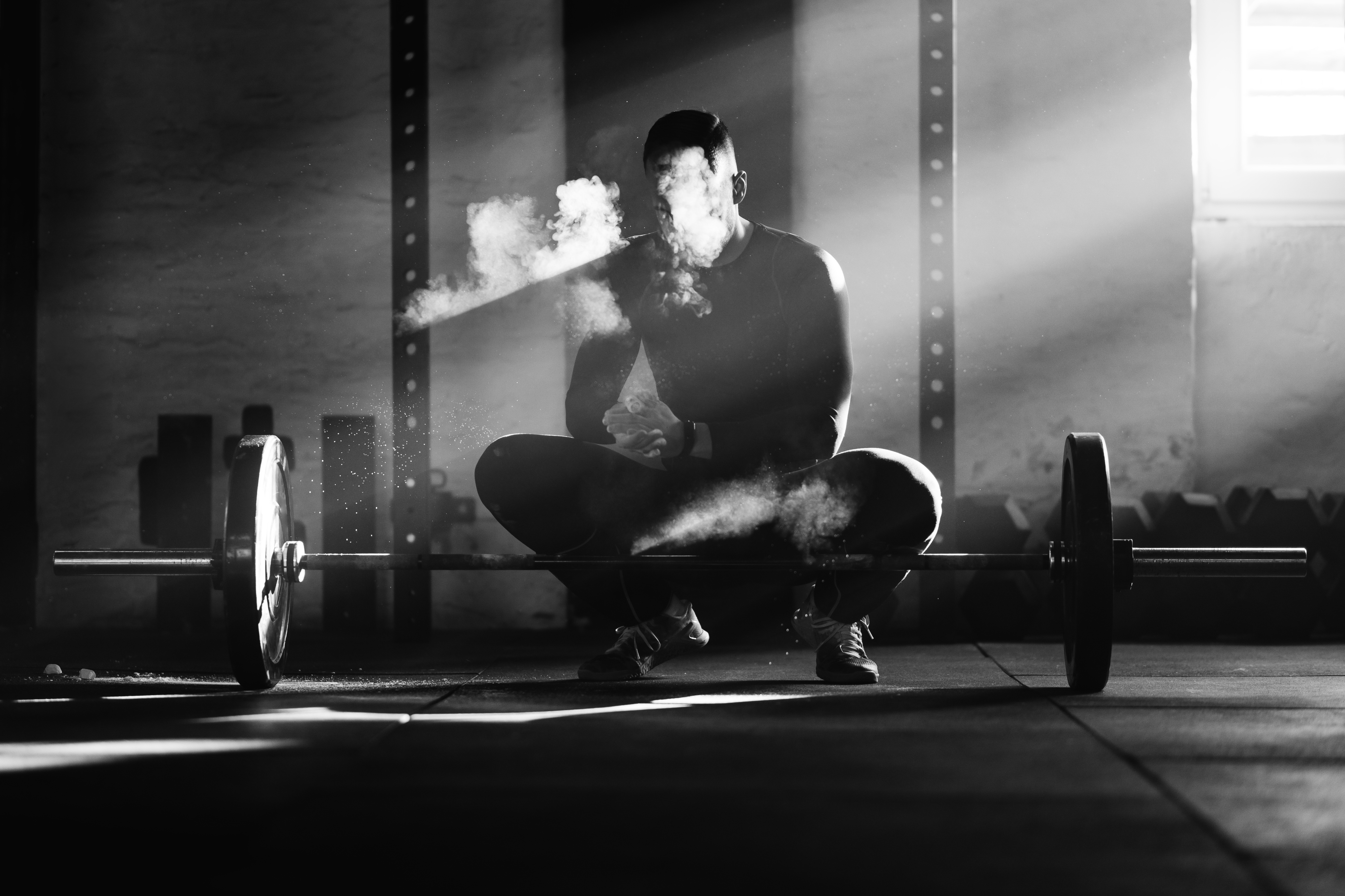 Man in a gym with chalk powder